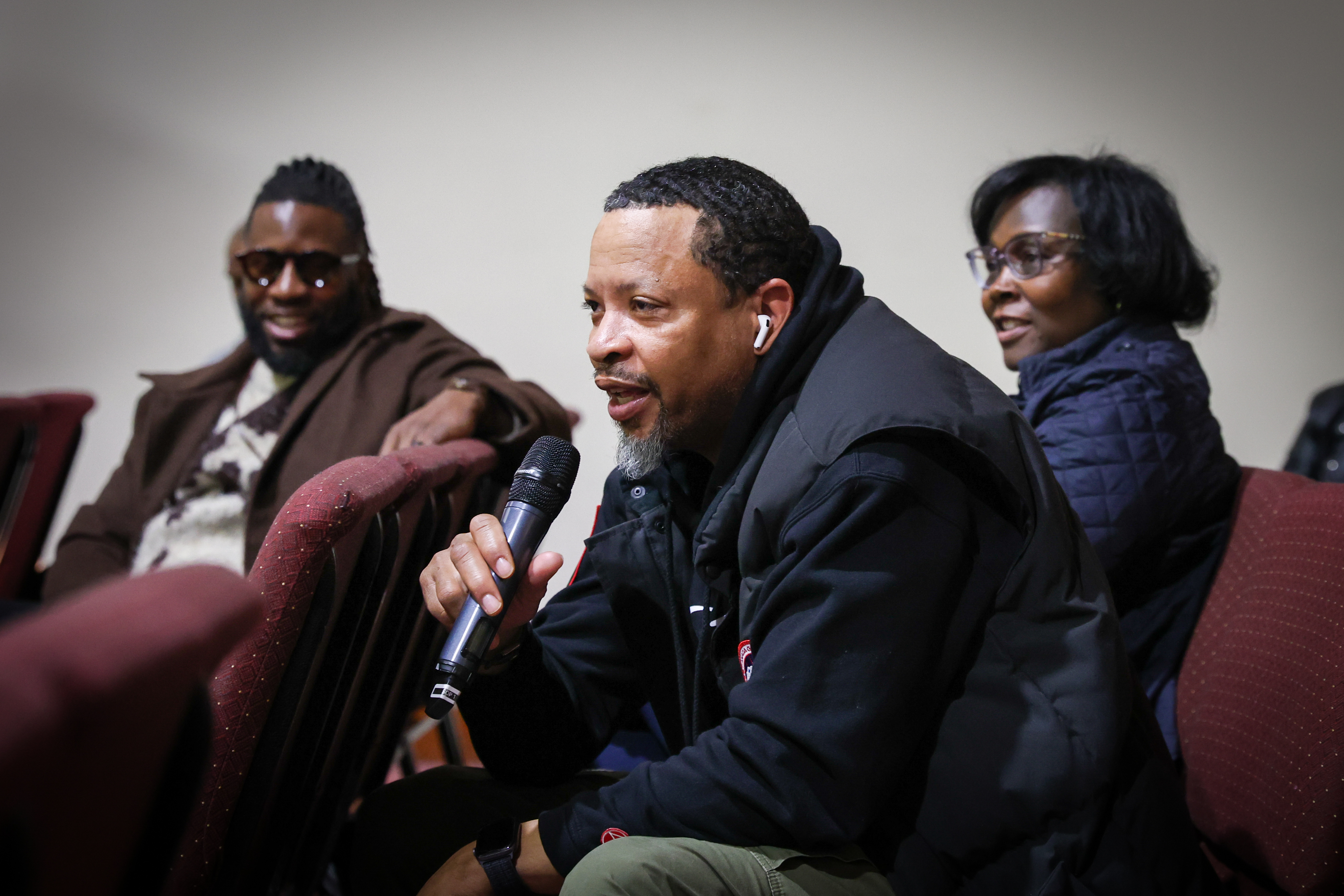 community member asks a question during panel on education