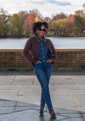 Davida Janae Lovelace on a stone path with water and trees in background