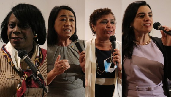 Cherelle Parker, Helen Gym, Maria Quiñones Sánchez, and Rebecca Rhynhart holding microphones