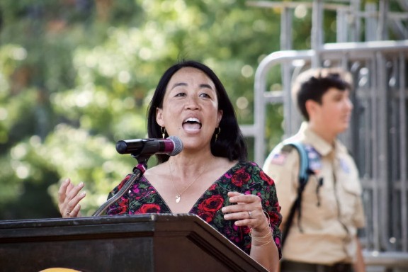 Helen Gym speaking at an outdoor podium