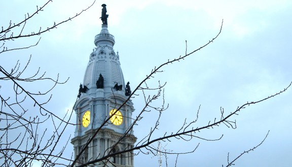 Philadelphia City Hall with bare tree branches in winter
