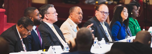 2023 mayoral candidates sitting at a table