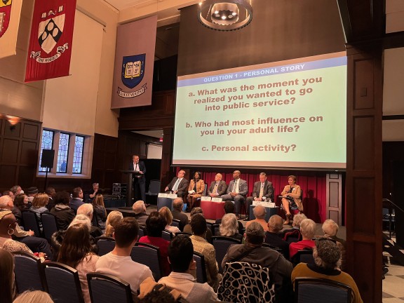 Mayoral candidates on stage in front of a large audience