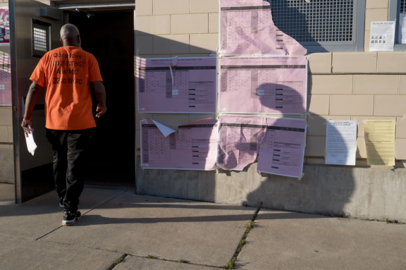 volunteer at polling place in the East Mount Airy neighborhood