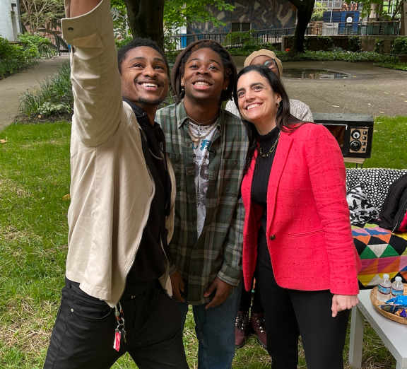 Two young people taking a selfie with mayoral candidate Rebecca Rhynhart