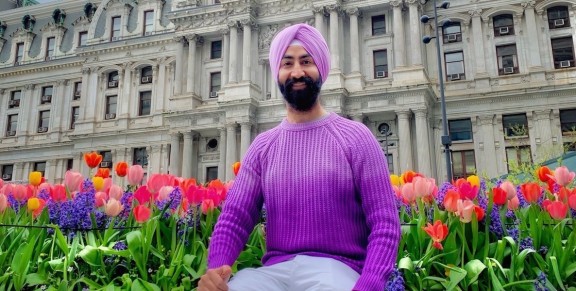 Arash Singh in front of City Hall