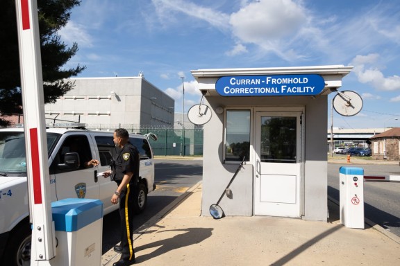 A van exits the parking lot of Curran-Fromhold Correctional Facility on State Road in Northeast Philadelphia.