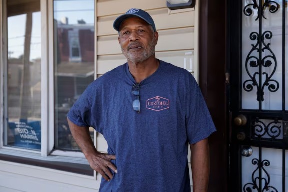 A man standing on his porch