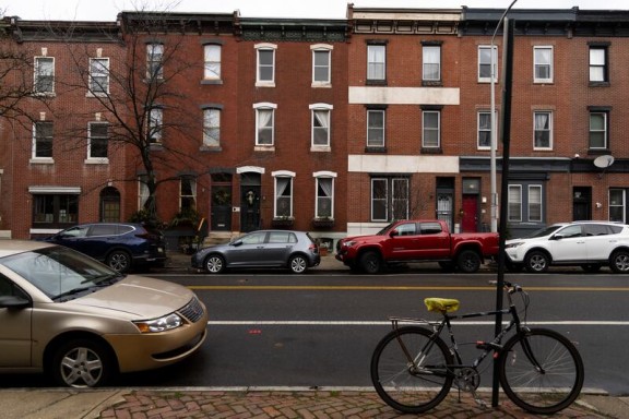 Philadelphia street with red brick row homes