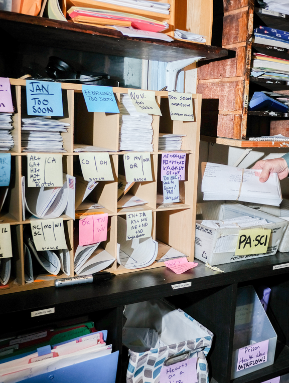 Image of Books Through Bars workspace, which includes bookshelves with rows of books like the one pictured here