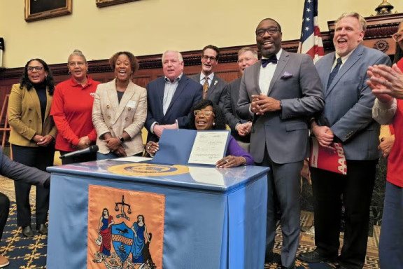 Philadelphia Mayor Cherelle Parker signs the Philly Saves bill January 20, 2026. (Tom MacDonald/WHYY)