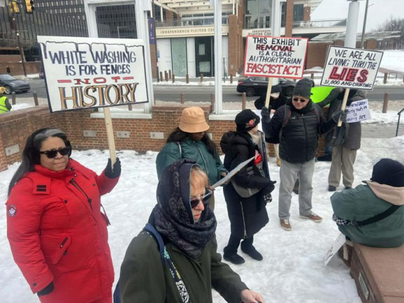 Protesters rally on the snowy grounds of the stripped President’s House exhibit at 6th and Market on Friday.  — TRIBUNE PHOTO/MARCO CERINO