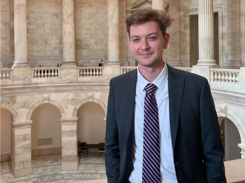 Harrison Morgan wearing a suit inside city hall