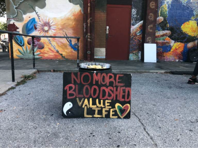 Sign saying no more bloodshed, value life in front of Mill Creek Recreation Center