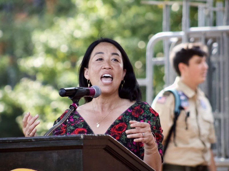 Helen Gym speaking at an outdoor podium