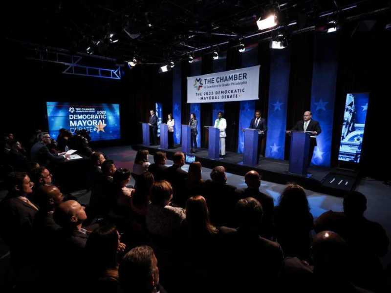 Mayoral candidates on stage at a forum hosted by the Chamber of Commerce