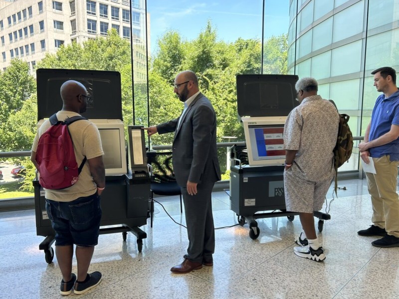 Voters getting a demo of PA voting machines