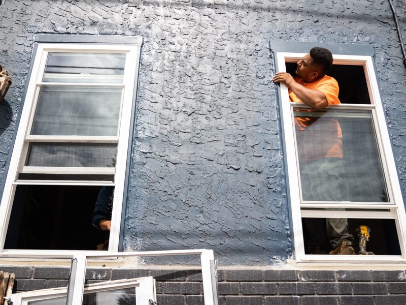 Contractor installing a window 