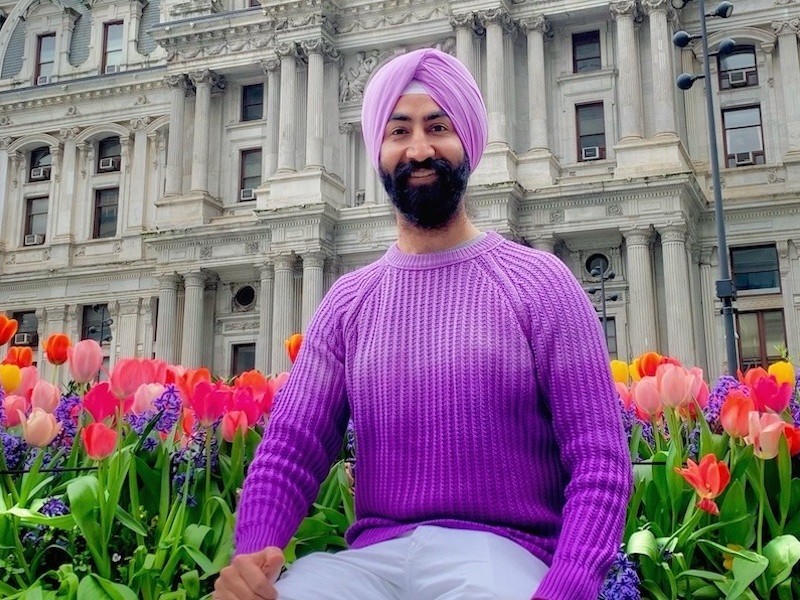 Arash Singh in front of City Hall