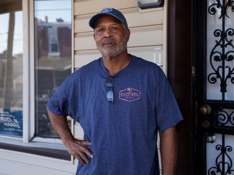 A man standing on his porch