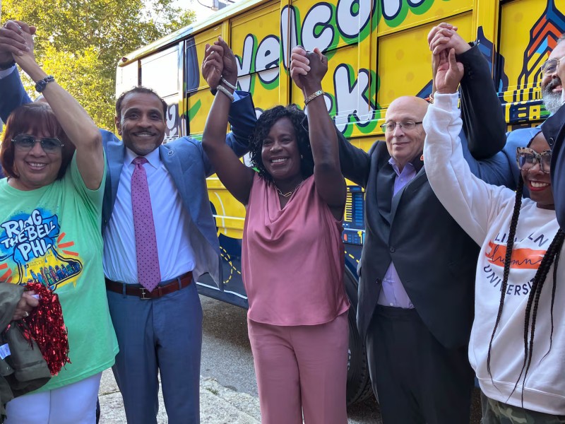 Philadelphia Superintendent Tony Watlington, second from left, Mayor Cherelle Parker, and Philadelphia Federation of Teachers President Arthur Steinberg stand along others on the first day of school on Monday, Aug. 25, 2025 (Carly Sitrin / Chalkbeat)