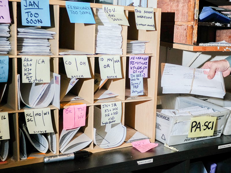 Image of Books Through Bars workspace, which includes bookshelves with rows of books like the one pictured here