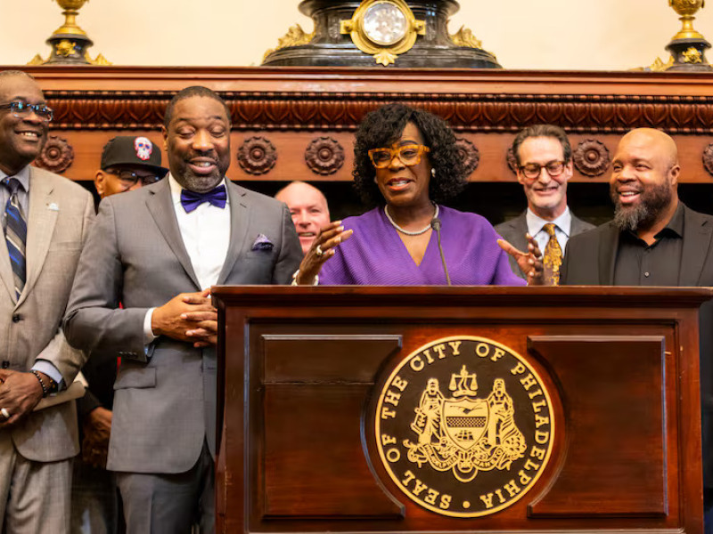 Mayor Cherelle L. Parker speaks during a news conference about a plan to redevelop Brith Sholom House in Wynnefield. From left to right is PHA President and CEO Kelvin Jeremiah, City Council President Kenyatta Johnson, Parker, and Ryan N. Boyer, business manager of the Philadelphia Building and Construction Trades Council. Tyger Williams / Staff Photographer