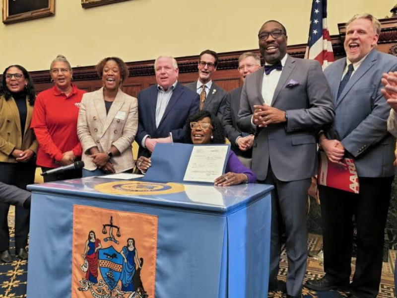 Philadelphia Mayor Cherelle Parker signs the Philly Saves bill January 20, 2026. (Tom MacDonald/WHYY)